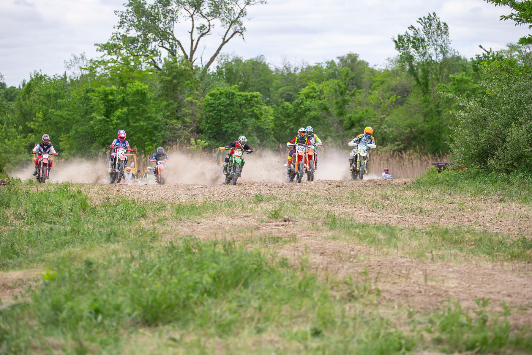 May be an image of 6 people, dirt bike and motorcycle