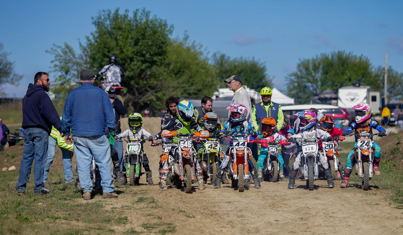 May be an image of one or more people, motorcycle, dirt bike and outdoors