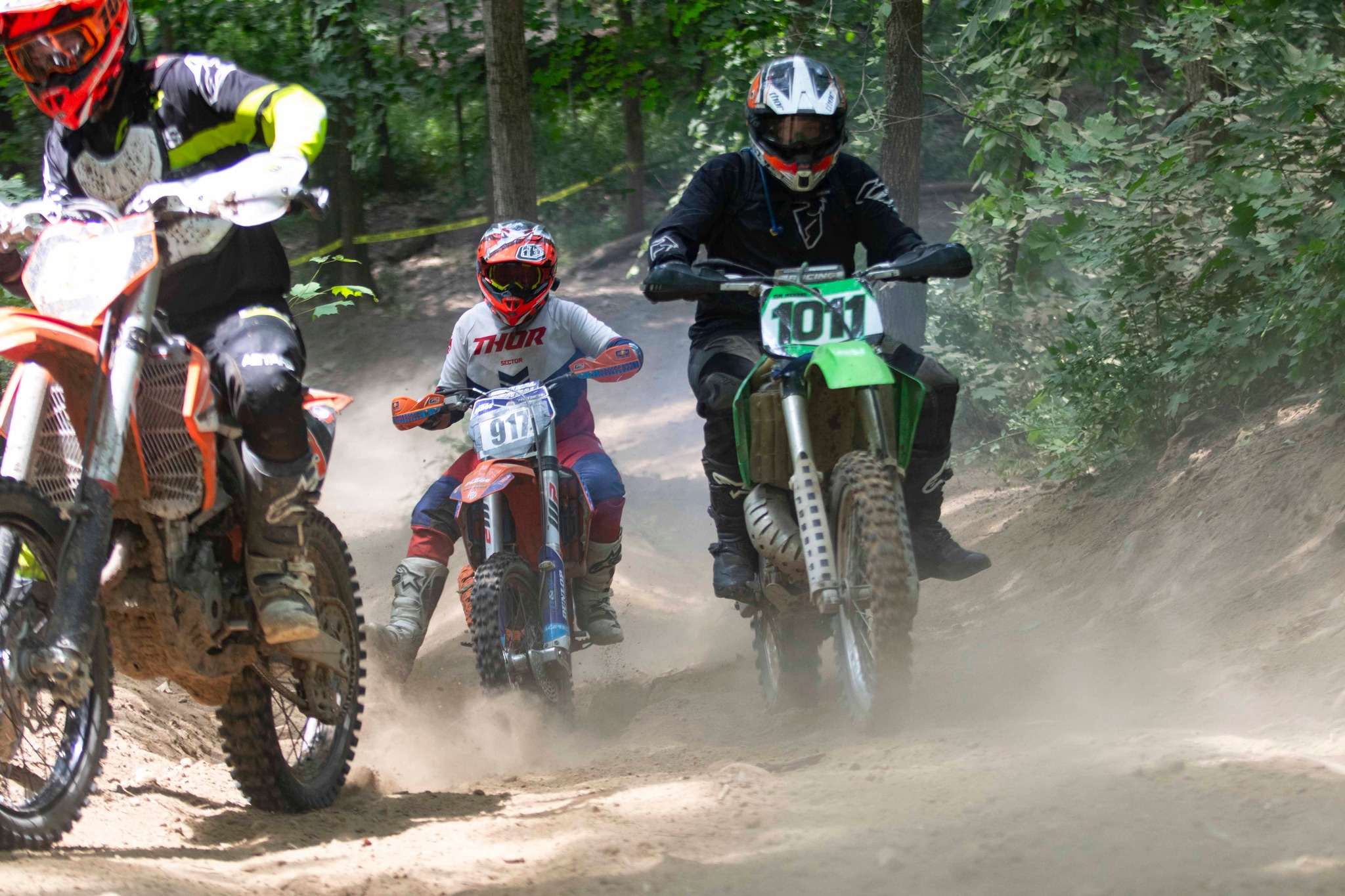 May be an image of 3 people, dirt bike, motorcycle and text