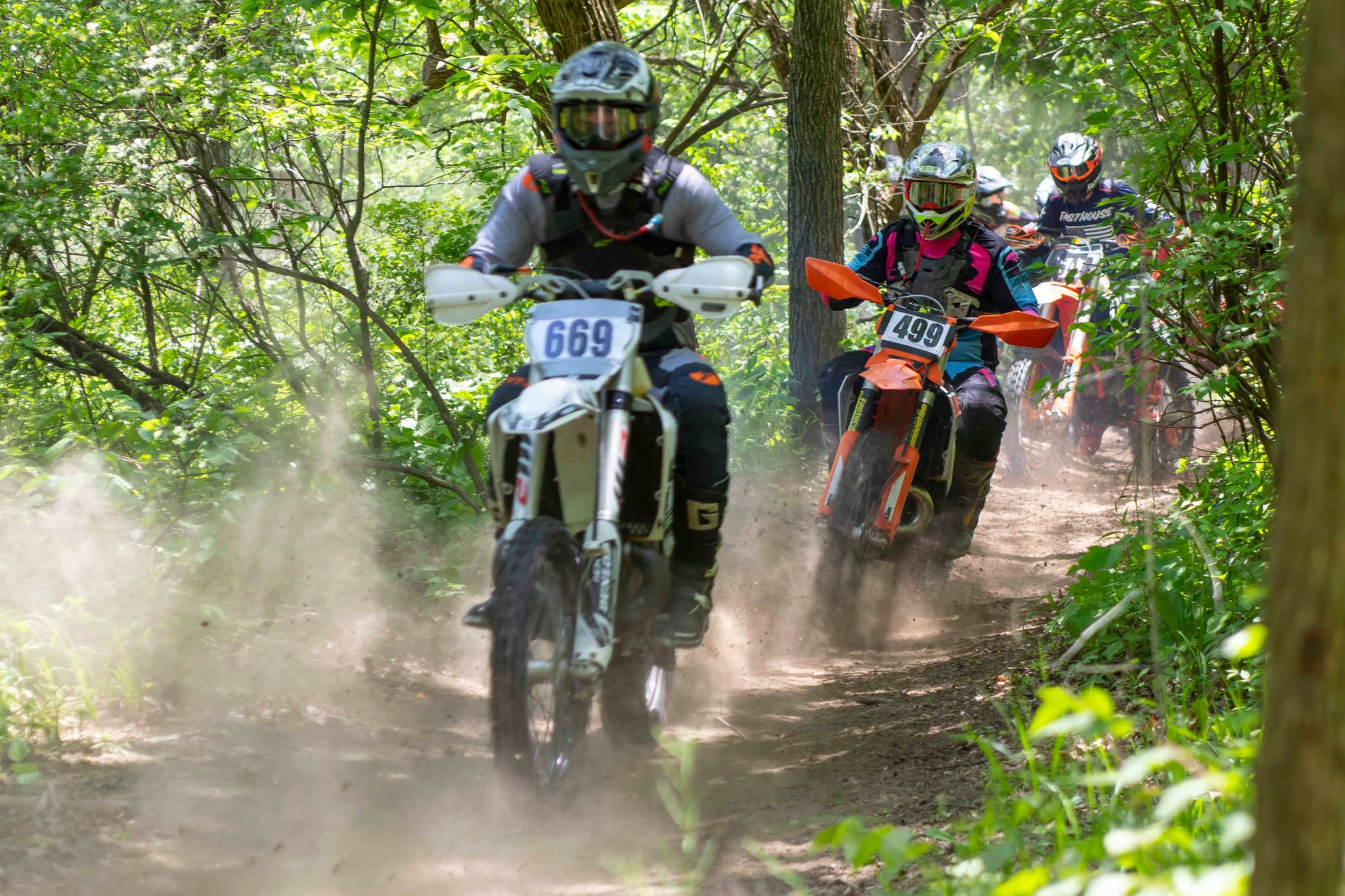 May be an image of 3 people, dirt bike, motorcycle and text